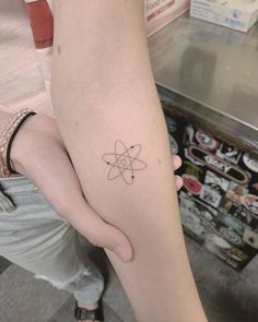 a person with a small tattoo on their arm