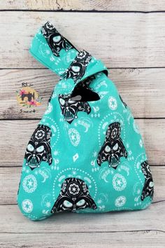 a blue bag with skulls on it