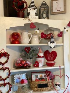 valentine's day decorations are displayed on the shelves