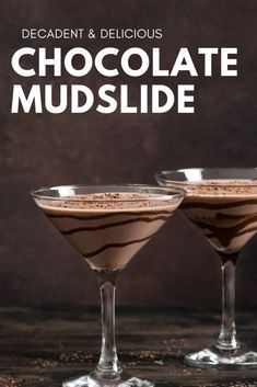 two glasses filled with chocolate mudslide on top of a wooden table next to each other