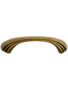 an antique brass cabinet pull handle on a white background