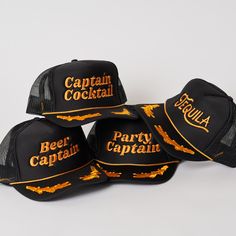 Captain Cocktail Trucker Hat Beach days are the best days! This his or hers trucker is part of our Party Collection. Cute and perfect for your next party day in the sun. So light, medium profile and a perfect addition to your growing hat collection. 5 Panel Foam Mesh Back Trucker, Pro Style Adult Sizing 100% Poly Foam Front, 100% Nylon Back Fun Party Cap Hat, Fun Party Cap, Novelty Summer Party Hats, Summer Gold Trucker Hat, Summer Party Trucker Hat, Black Snapback Hat For Summer Festival, Adjustable Gold Baseball Cap For Summer, Novelty Snapback Trucker Hat For Party, Novelty Snapback Party Hats