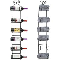 two wine racks with towels hanging from them and one holding several bottles on it's side