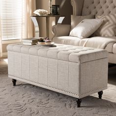 a large white bed sitting on top of a carpeted floor next to a window