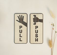 two wooden signs that say push and pull