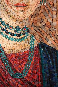 a woman's face is made out of mosaic tiles