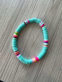 a bracelet made out of strips of paper