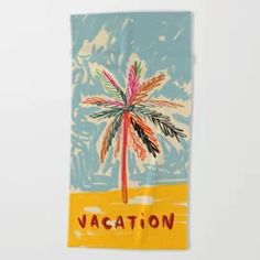 a beach towel with a palm tree on it and the words vacation written in red