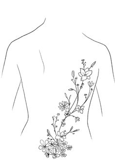 the back of a woman's body with flowers on it