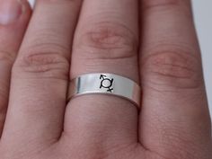 This Gender Fluid Symbol Ring is the perfect way to express gender fluidity and support the LGBTQIA2S+ community. Crafted from high-quality materials, this beautiful and stylish ring serves as a reminder that everyone has the right to choose how to express their identity. Wear it with pride and show off your belief in inclusion! Product Details: Materials: Aluminum, Sterling Silver, Fine Silver, 14k Gold Filled Color: Silver, Gold, Rose Gold Size: 6mm You will receive one hand-stamped ring fille Gender Fluidity, Stamped Ring, Hand Stamped Ring, Gender Fluid, Stamped Rings, Right To Choose, Stylish Rings, Black Enamel, Fine Silver