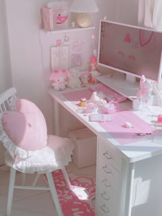 a desk with a computer, chair and other items on it in a pink room