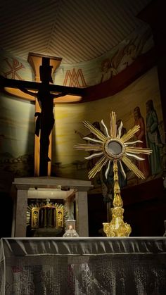 the crucifix is on display in front of an image of jesus's cross