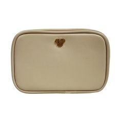 a white bag with a gold heart on the front and bottom part of it's flap