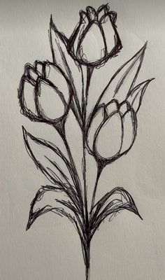 a drawing of some flowers on a piece of paper that is drawn with black ink