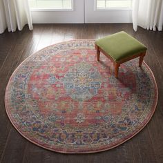 a round rug with a green bench in the middle