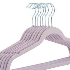 a set of pink hangers with white clips on each one side and five rows of lavender colored hangers in the middle