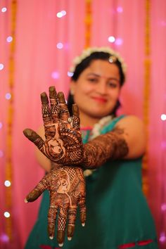 a woman with henna on her hands