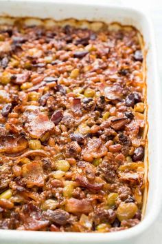 a casserole dish with meat and beans in it