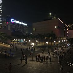 many people are walking around in the city at night