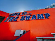 this is the swamp sign on an orange building