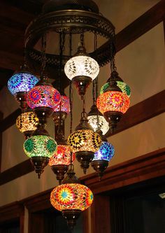 a chandelier with many colorful lights hanging from it