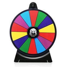 a colorful spinning wheel with a skull on the center and black stand for display purposes