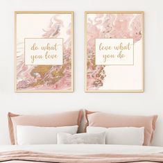 two framed art prints above a bed in a white room with pink and gold decor