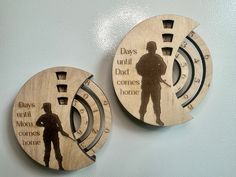 two wooden brooches with the words days until dad comes home