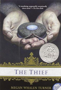 the thief by megan whelen turner book cover with two hands holding a coin