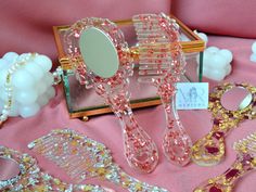 some pink and gold items on a table