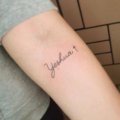 a woman's arm with a tattoo that reads, yeehuat