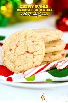 three cookies on a plate with candy canes