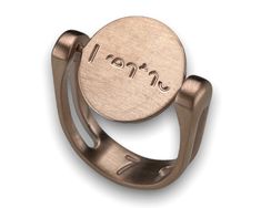 an adjustable ring with the word love engraved on it's center, in bronze