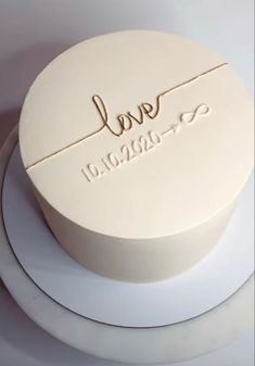 a white cake with the word love on it