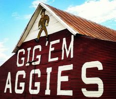 a red barn with a sign that says go'em aggies on it