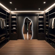 a walk - in closet with wooden floors and black walls