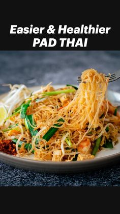 a white plate topped with noodles and veggies