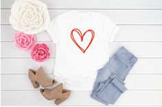 Cute Valentines Day Tee for women These adorable valentines day tshirts are available in Multiple Colors. This sweet shirt with a modern doodle heart design is made from the softest material in high quality print making it perfect to layer this Valentines Day. Pair this comfy t-shirt with your favorite jeans or leggings and jacket for and adorable V-day outfit ! Handmade with Love...Great for valentines day outfits and casual wear for the rest of the year !! Sizes: XSmall (0-4) Small (4-6) Mediu Trendy Cotton T-shirt For Valentine's Day, Trendy Heart-shaped T-shirt For Spring, Trendy Valentine's Day T-shirt With Graphic Print, White Casual T-shirt For Valentine's Day, Cute Cotton T-shirt With Heart Shape, Cute Cotton T-shirt With Heart Design, Cute Heart-shaped Cotton T-shirt, Trendy Heart Print T-shirt For Spring, Trendy Relaxed Fit T-shirt With Heart Print