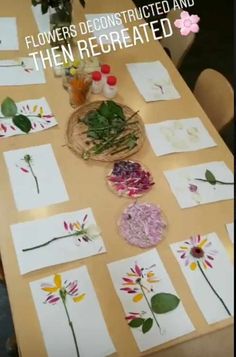 the table is covered with paper and flowers