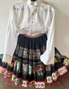 Vintage Peruvian embroidered festival wool skirt above the  knee length floral - ties on both sides. Hand made. Measures as follows: Waist 20 flat -ties on both sides Length 20 In excellent vintage as found condition -no smells or tears.    Authentic Andean Peruvian Textile. *Please note that this skirt has led a previous life, and may tell a story through minor imperfections. You may feel confident though that you're making a positive choice to care for the planet when buying it!i Embroidered Fitted Skirt For Fall, Fitted Embroidered Skirt For Fall, Fitted Embroidered Fall Skirt, Traditional Fitted Skirt For Spring, Fitted Folk Style Skirt, Traditional Embroidered Mini Skirt, Traditional Embroidered Fitted Skirt, Traditional Fitted Embroidered Skirt, Bohemian Fitted Skirt With Multicolor Embroidery