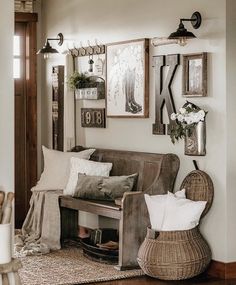 a living room filled with furniture and pictures hanging on the wall next to a door