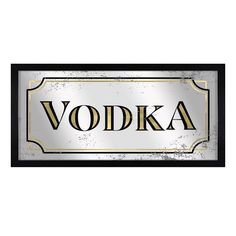 a metal sign with the word vodka written in black and gold on it, against a white background