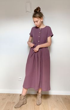 "Long dress made of high quality double gauze fabric. Front fastening with cocounut buttons. Short  sleeve. Side pockets.  Loose fit. Matching belt is added. You can buy the matching children's dress here: https://www.etsy.com/listing/1333429354/girls-double-gauze-dress-winter-moss?click_key=64835348e0c4fa9a7034d6e28e2a0f162ea83b9d%3A1333429354&click_sum=9db1b7b5&ref=shop_home_recs_14&crt=1&sts=1 XS/6-8  bust 30 1/2\"- 31 1/2\", waist 23\"-24\", hip 32 1/2\" - 33 1/2\" bust 78-80cm, waist 58-61c Linen Dress Winter, Simple Cotton Dress, Dark Wash Relaxed Fit Dress With Button Closure, Mennonite Dress Ideas, Double Gauze Dress Pattern, Double Gauze Dress, Simple Tunic Dress, Washed Blue Cotton Dress With Button Closure, Mennonite Dress