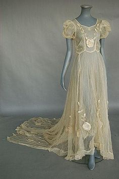 An ivory tulle bridal gown and headress circa 1935, the bodice and long, trained skirt adorned with large satin roses and chenille embroidery Vintage Weddingdress, Dramatic Romantic, Style Année 20, Chenille Embroidery, Victorian Dresses, Old Dresses, Antique Wedding, Satin Roses, Wedding Gowns Vintage