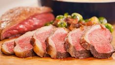 some meat and vegetables on a cutting board