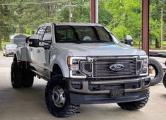 a silver truck parked in a parking lot