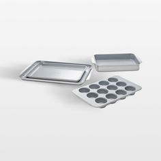 three pans with muffin tins next to each other