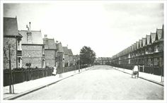 an old black and white photo of a street