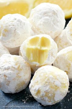 lemon meringue truffles are piled on top of each other