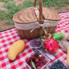 a picnic table with fruits and vegetables on it